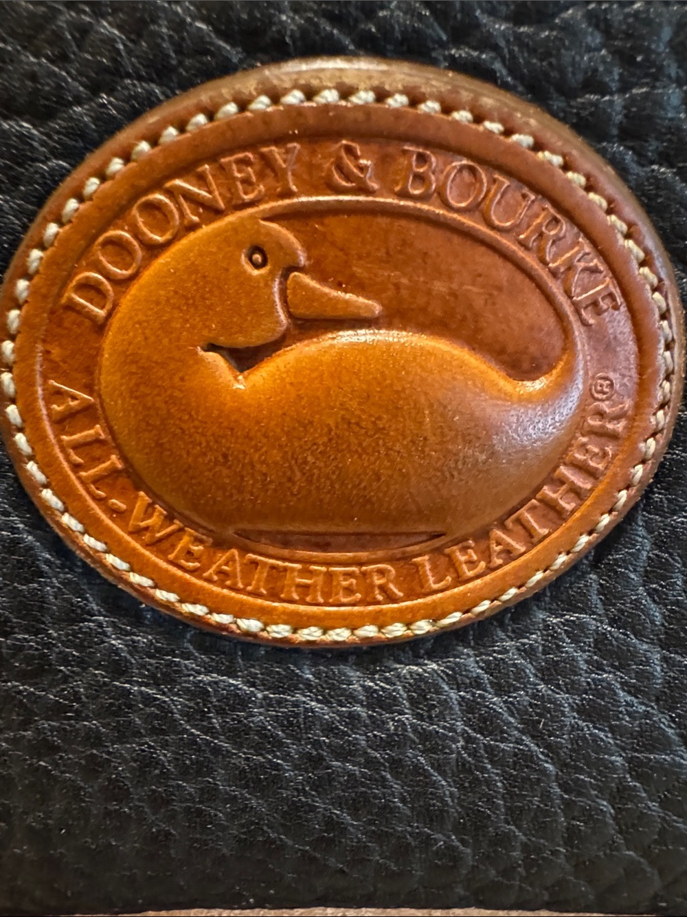 Dooney & Bourke Black Leather Women’s Bag with Brown Leather Logo Patch